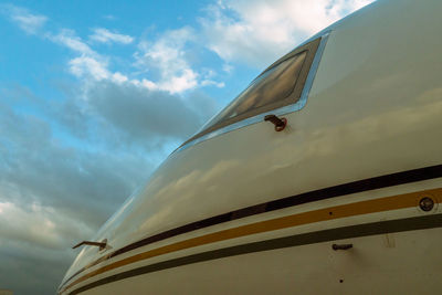 Low angle view of airplane against sky