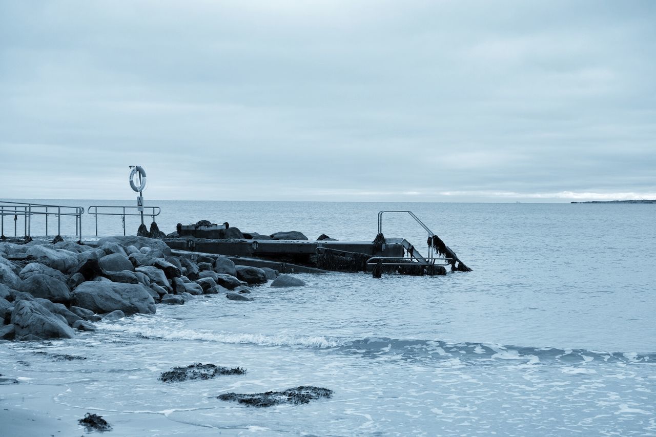 sea, horizon over water, water, beach, sky, shore, tranquility, tranquil scene, scenics, beauty in nature, nature, rock - object, wave, pier, cloud - sky, idyllic, transportation, day, nautical vessel, outdoors