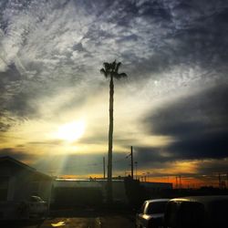 View of road against cloudy sky at sunset