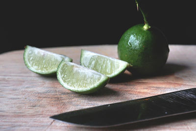 Close-up of green lemons on table