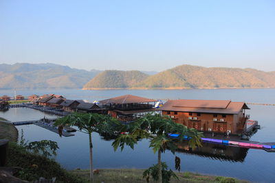 High angle view of swimming pool by lake against sky