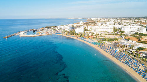 High angle view of swimming pool by sea against sky