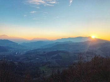 Scenic view of mountains against sky during sunset