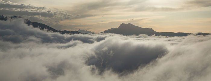 Low angle view of mountains against sky during sunset