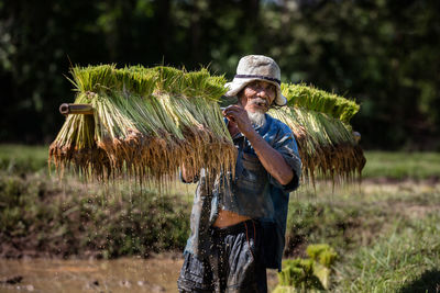 Full length of man working on field