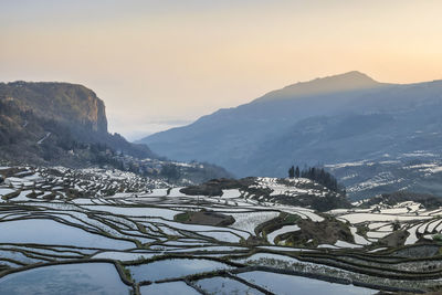 Scenic view of mountains against sky during winter