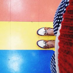 Full length of woman standing on tiled floor