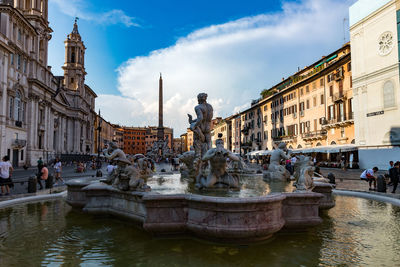 Statue of fountain in front of building