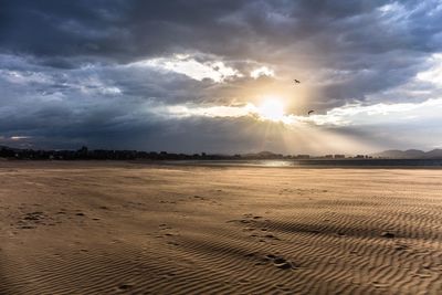 Scenic view of landscape against cloudy sky