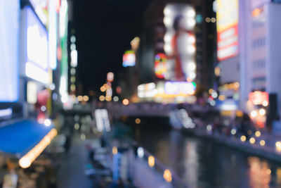 Defocused image of illuminated city at night