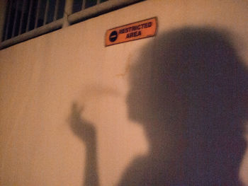 Close-up of text on shadow