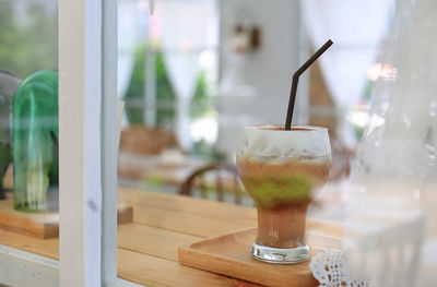 Close-up of coffee in glass on table