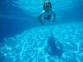 Woman swimming in pool