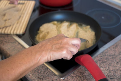 High angle view of person preparing food in kitchen