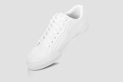 Close-up of shoes over white background