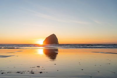 Scenic view of sea against sky during sunset