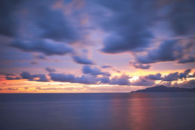 Scenic view of sea against sky at sunset