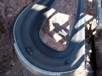 High angle view of cars on road amidst rock formation