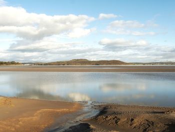 Scenic view of beach against sky