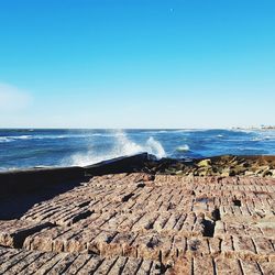 Scenic view of sea against clear sky