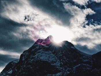 Low angle view of snow on mountain against sky