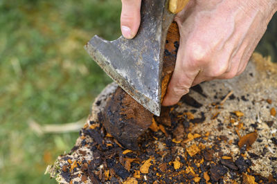 Close-up of man working on metal