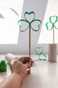 Diy paper clover with toilet roll tube for saint patrick day celebration, zero waste decor for party