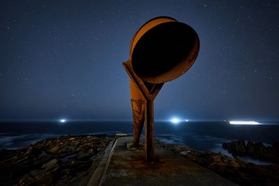Scenic view of sea against sky at night