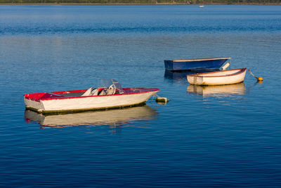 Boats moored in sea