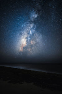 Scenic view of sea against sky at night