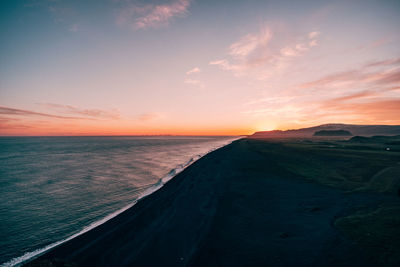 Scenic view of sea against sky at sunset