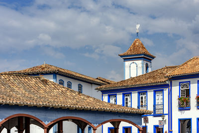 Buildings in city against sky