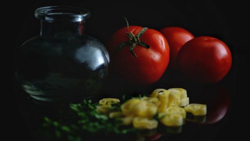 Close-up of fruits against black background