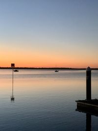 Scenic view of sea against clear sky during sunset
