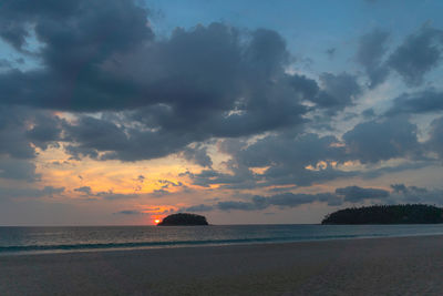 Scenic view of sea against sky at sunset