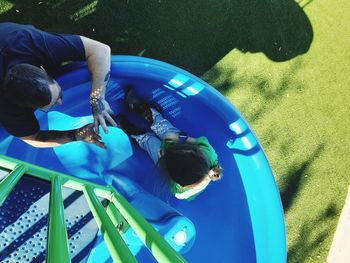 High angle view of people playing in swimming pool