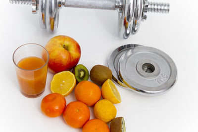 High angle view of oranges in glass container