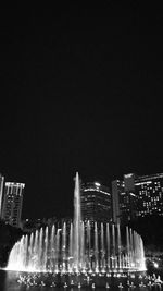 Low angle view of illuminated buildings at night