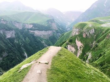 Scenic view of landscape and mountains against sky