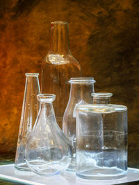 Close-up of glass bottles on table