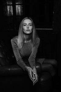 Portrait of teenage girl sitting on sofa