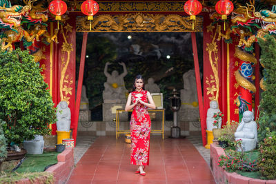 Portrait of man standing in red temple