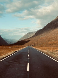 Empty road against sky