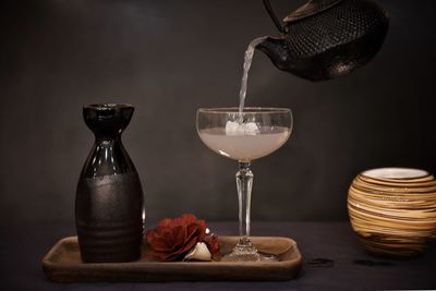 Close-up of wine glasses on table