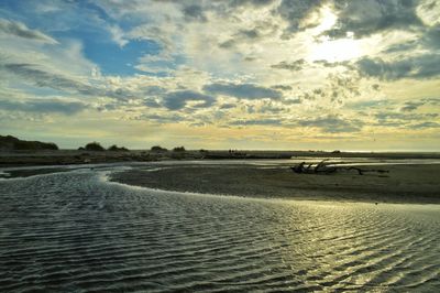 Scenic view of sea against cloudy sky