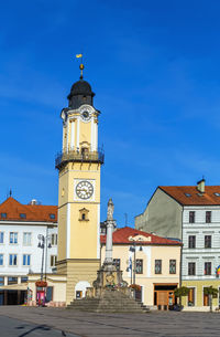 Clock tower on slovak national uprising square in banska bystrica, slovakia