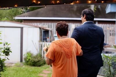 Rear view of friends at temple