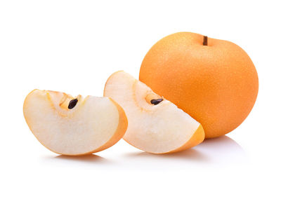 Close-up of pears against white background