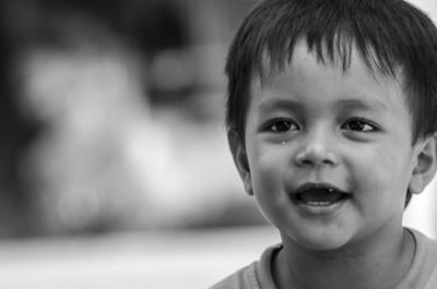 Close-up of cute boy looking away