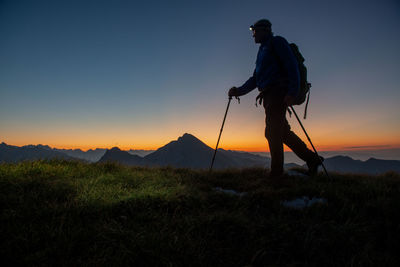 Hiker with flashlight on his forehead